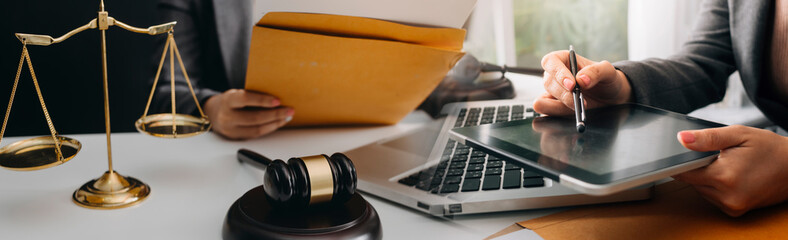 Business and lawyers discussing contract papers with brass scale on desk in office. Law, legal...