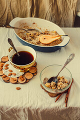 Pear crumble with streusel, top view, on a light linen cloth. Morning breakfast.. Selective focus