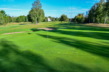 Obraz premium shadows over a golf green in Sweden
