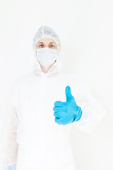A man in a protective suit gloves and face mask.  Shows the like gesture. Isolated on a white background