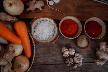 Fresh ingredients and vegetables Placed in the table For making Kimchi Which contains ingredients such as ginger, garlic, salt, onion, sugar, gochugaru (Korean chili). Kimchi is a healthy food.