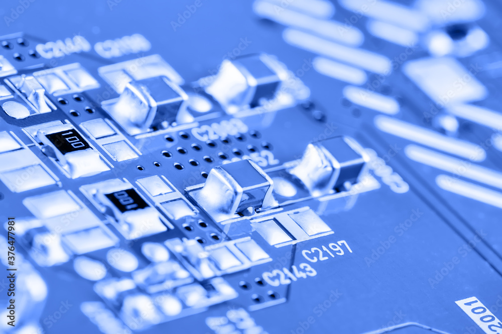 Poster electronic circuit board close up. blue background.