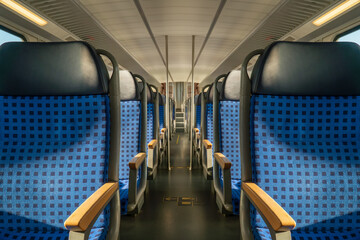 Fototapeta premium Clean hygiene empty seat on europe Germany public transportation train subway bus with sunlight for traveler to travel during vacation with nature view on window