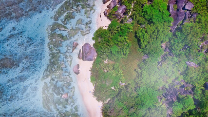 Overhead aerial view of Anse Source Argent in La Digue, Seychelles from drone