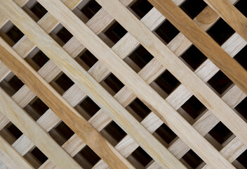 Close-up of wooden handcraft texture background with diagonal square grid for decoration on the wall or partition.
