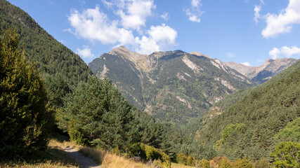 Scenic mountain view with some clouds in a sunny day