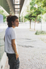 Young man posing in the city streets