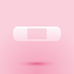 Paper cut Bandage plaster icon isolated on pink background. Medical plaster, adhesive bandage, flexible fabric bandage. Paper art style. Vector.