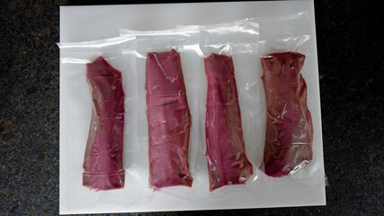 fresh game meat, fillets from the deer are prepared for the freezer