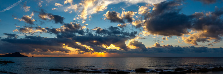 amazing panorama of sunrise or sunset above the seashore and horizon