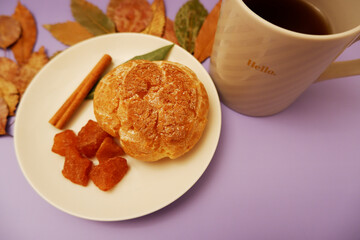 Fototapeta na wymiar Cinnamon sweets and cup of coffee on colorful background. シュークリームとコーヒー