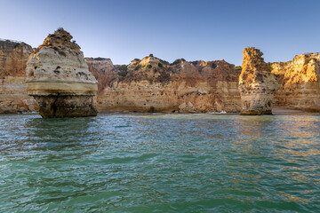 View of the beautiful rocks and cliffs beaches in Portimao City Coast, famous tourist destination in Portugal.