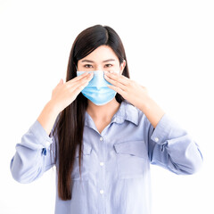 Beautiful asian young woman standing and show how to wear hygiene protect mask on face to protective infection and outbreak of coronavirus or covid-19 isolated on white background. Healthcare concept.