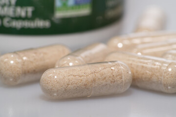 vegetarian capsules laid on white table isolated