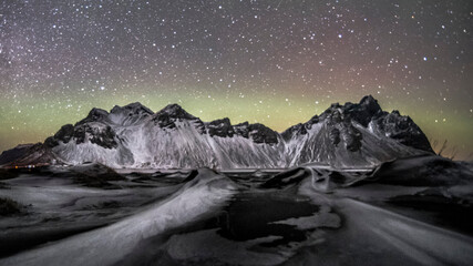 night sky mountain with aurora borealis