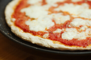 Preparation of classic home made margherita pizza