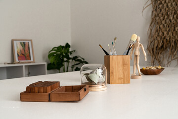 Modern wooden objects in a white workspace on a table