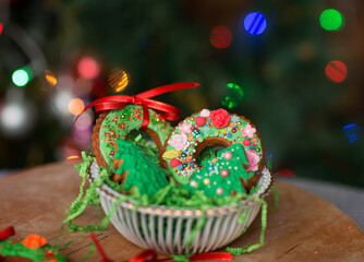 Naklejka premium Home made Christmas cookies against the Christmas lights background.