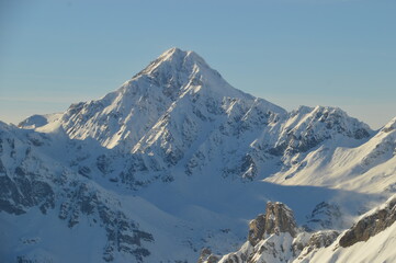 Obraz premium Skiing in the snow covered mountains of the San Domenico Ski Resort in Alps in Northern Italy