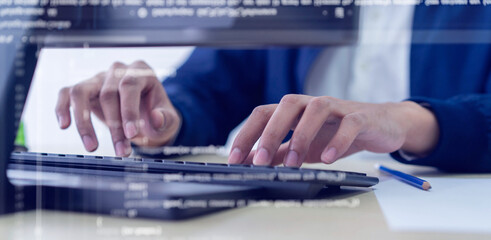 close up programmer man hand typing on keyboard at computer desktop for input coding language to software for fix bug and defect of system in operation room , development of technology concept	 