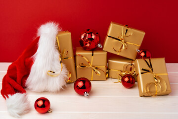 Christmas gift boxes against red background front view