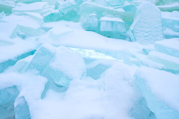 chunks of ice are lying on the surface of the reservoir