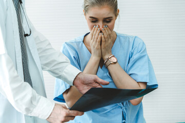 Doctor and unhappy patient at hospital or medical clinic . Healthcare medical malpractice and...
