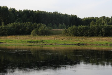 View of the river in the countryside at sunset