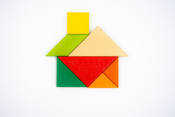 Color wood tangram puzzle in House shape on white background