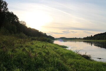 Fototapeta na wymiar View of the river in the countryside at sunset