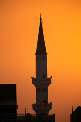 Minaret at sunrise a view from Busiateen coast, Bahrain