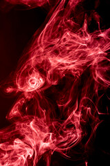 Red abstract shaped smoke against black background. Abstract background