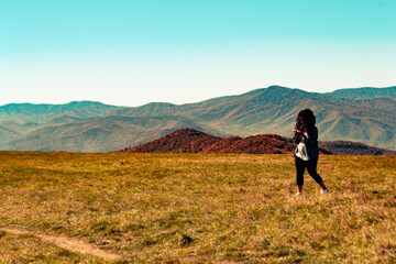 Woman Hiking and Texting on a Bald Mountain