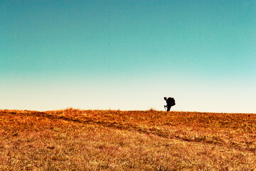 Hiker on a Bald Mountain in the Fall
