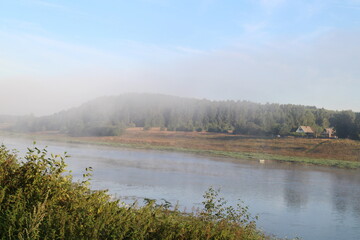 View of the misty river from the morning in summer