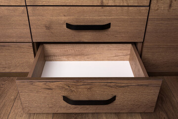 Empty open wooden drawer. Storage box.