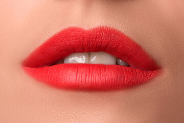 Beautiful female lips close up. Red lipstick. Luxury makeup.