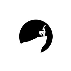 Deer silhouette standing on a hill. Moose silhouette at dusk or twilight. Wildlife scenic view.