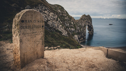 Old stone sign Man of War and Durdle door, Jurassic coast, Dorset, England, Europe