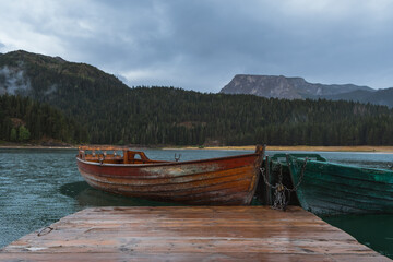 Wooden boats on the lake on cloudy day