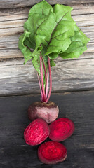 fresh beets on a rustic wooden background in the section