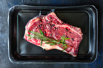 rib eye steak meat beef fresh juicy on the table serving portion size top view place copy space for text