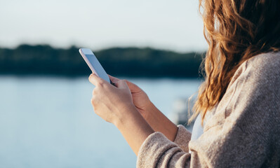Close up of unrecognizable woman using phone stock photo
