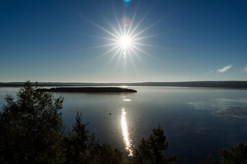 fog creeps over the surface of the water, sunrise over the lake, early morning. nature of Russia, lake Kandrykul, southern Urals