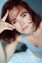 Beautiful young stylish ginger woman with freckles. Fashion portrait of charming girl wearing...