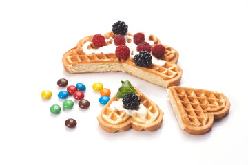 Belgium waffles with fresh berries isolated on white background