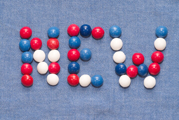 new word written with colorful candies