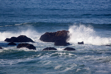 Rocks greeting the waves