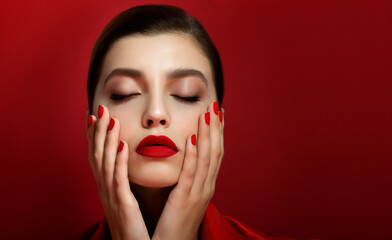 Portrait of beautiful young woman wearing red clothes with perfect young skin, red matt lips and nails. - obrazy, fototapety, plakaty