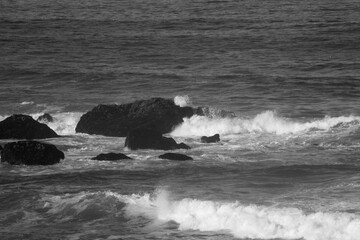 Surf breaking on a rocky shore